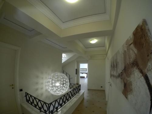 a hallway of a house with a chandelier on the ceiling at Villa LIDSON in Golem