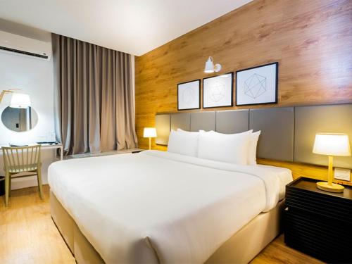Ein Bett oder Betten in einem Zimmer der Unterkunft Avior Hotel