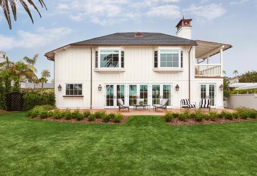 a large white house with a lawn at Rosewood Miramar Beach in Santa Barbara