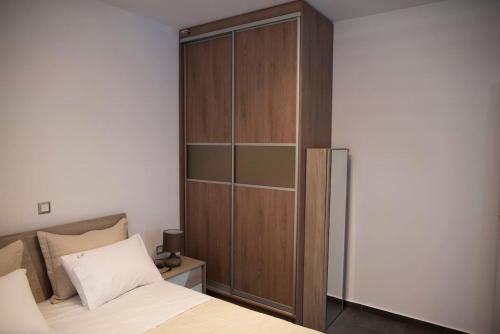 Ένα ή περισσότερα κρεβάτια σε δωμάτιο στο Lf Suites - Irene