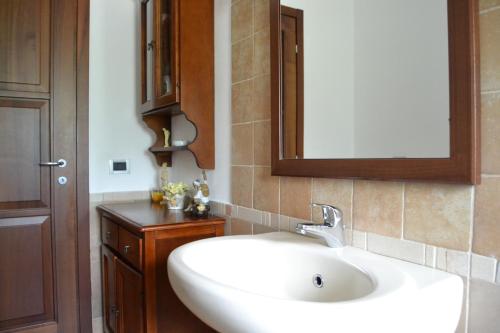 a bathroom with a white sink and a mirror at Varazze Sea Mountain 2 in Varazze