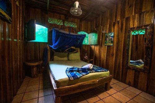 Кровать или кровати в номере Hotel La Costa de Papito