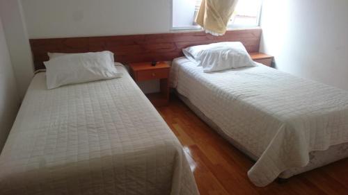 
Cama o camas de una habitación en Hostal Quepay
