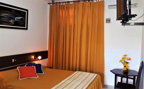 Postel nebo postele na pokoji v ubytování Hotel Praia do Conde