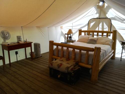a bedroom with a bed in a tent at The Woods Inn in Inlet