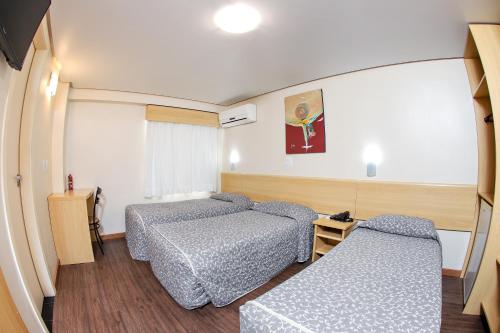 Postel nebo postele na pokoji v ubytování Hotel Express Terminal Tur - Rodoviária Porto Alegre