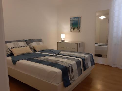 a bedroom with a bed and a bathroom with a tub at House Marija island Krk in Punat