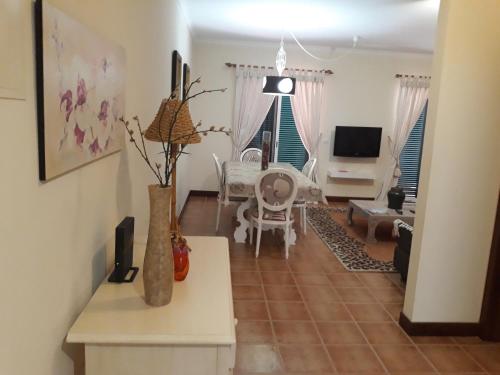 a living room with a couch and a table at Apartamentos Arrifes 1 in Porto Santo