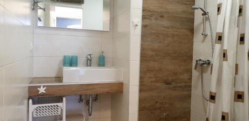 a bathroom with a sink and a shower at House Marija island Krk in Punat