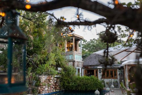 a house with a large window on top of it at Emily Moon River Lodge in Plettenberg Bay