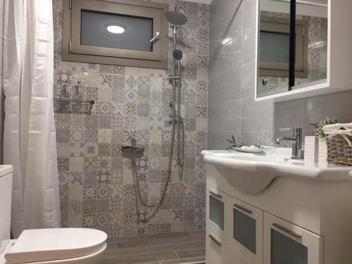 Koupelna v ubytování ImertI Apartment
