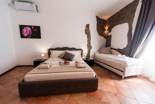 Posteľ alebo postele v izbe v ubytovaní Le Undici Rose Hotel