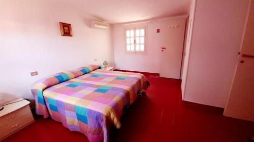 A bed or beds in a room at Casa Susy Bouganville 400 mt dal mare