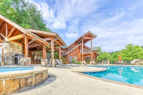 a log home with a swimming pool and a house at Golf View Condo in Pigeon Forge