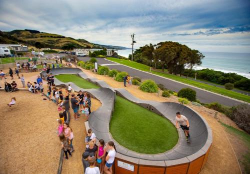 a crowd of people standing around a skate park at BIG4 Apollo Bay Pisces Holiday Park in Apollo Bay