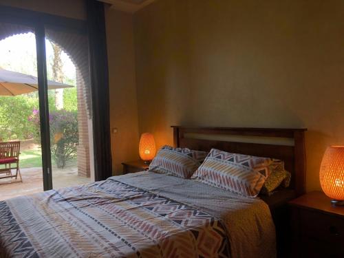 Cama o camas de una habitación en Palmeraie Charly's