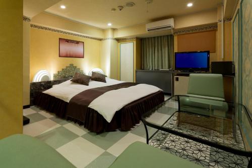 מיטה או מיטות בחדר ב-Hotel Xenia Mikumo (Adult Only)