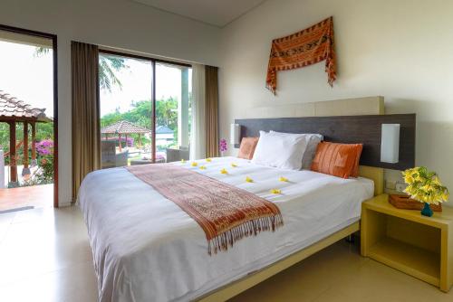 Un pat sau paturi într-o cameră la Villa Karingal