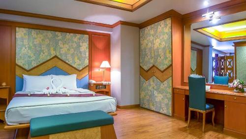 Cama o camas de una habitación en Ban Chiang Hotel