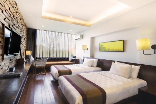 Televisyen dan/atau pusat hiburan di Watermark Hotel & Spa Bali