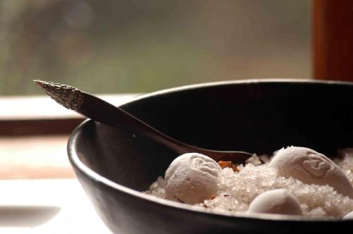a bowl of food with a spoon in it at Bukela Game Lodge - Amakhala Game Reserve in Amakhala Game Reserve