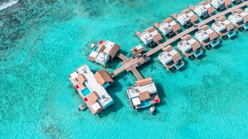 an aerial view of a resort in the water at Emerald Maldives Resort & Spa-Deluxe All Inclusive in Raa Atoll