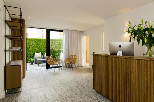 an office with a desk with a laptop on it at Central Beach Villas in Cape Town