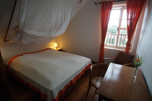 Кровать или кровати в номере Lovasoa 4C