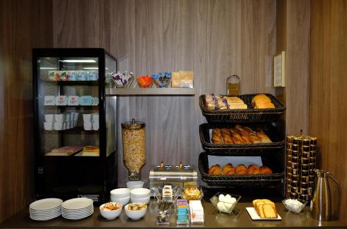 a bakery filled with donuts and pastries at Terminus Orléans Paris in Paris