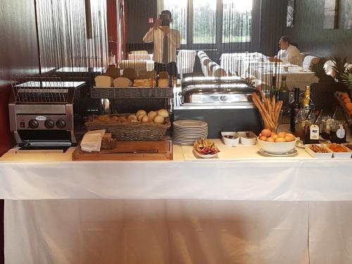 a table with a counter with food on it at Hotel Piccolo Portofino in Portofino