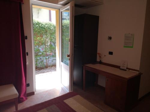 a bathroom with a sink and a sliding glass door at Ca' Del Sasso in Verona