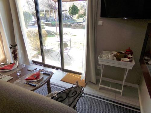 Khu vực ghế ngồi tại Chambre d’hôte - Ilse's Garden Chair