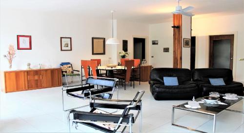 a living room with a couch and a table at Sun Terrace Sorrento in Sorrento