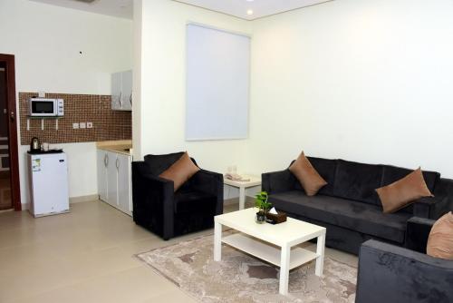 Η κουζίνα ή μικρή κουζίνα στο Diafa Saadet Serviced Apartments-Panda Alfayha