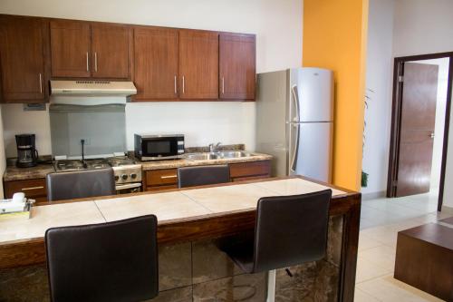 Kuchyň nebo kuchyňský kout v ubytování Madison Suites