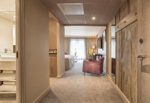 a hotel room with a corridor with a bedroom at Boulevard Hotel in Blackpool