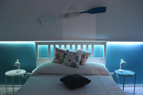 Posteľ alebo postele v izbe v ubytovaní Casa Vacanze Nadì