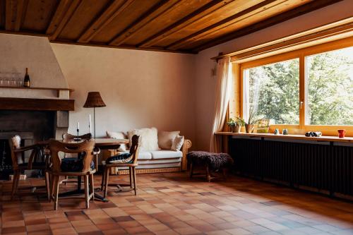 a living room with a table and a couch at Lake Villa Lotus in Luzern