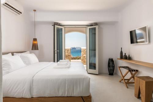 Postel nebo postele na pokoji v ubytování Obsession Mykonos