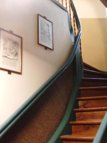 a stairway with two pictures on the wall at Hotel Angerer in Vilseck