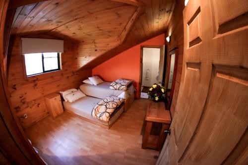 Postel nebo postele na pokoji v ubytování Cabañas Molino del Rey