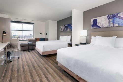 A bed or beds in a room at Hyatt House Chicago West Loop