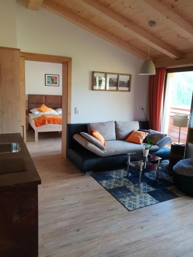 a living room with a couch and a bed at Binter Apartments in Virgen