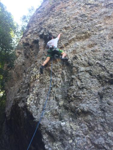 a man on a rocky mountain with two ropes at Medieval Village B&B in Ne