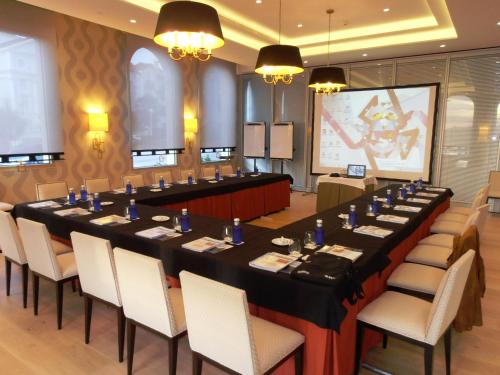 a large meeting room with a long table and chairs at Gran Hotel Sardinero in Santander