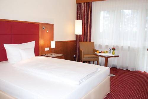 Katil atau katil-katil dalam bilik di Morada Hotel Heidesee Gifhorn