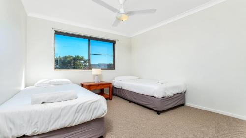 A bed or beds in a room at Beach Point - East Ballina