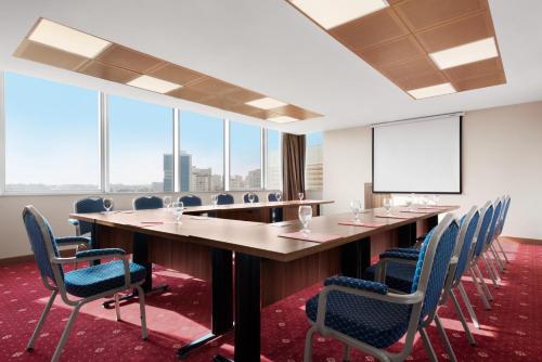 a conference room with a long table and chairs at Ramada by Wyndham Diyarbakir in Diyarbakır