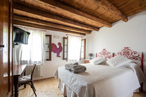 Una cama o camas en una habitación de Regina nel cuore del Veneto