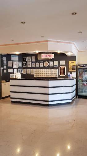 a store with a cash counter in a shopping mall at Miray Hotel Kleopatra in Alanya